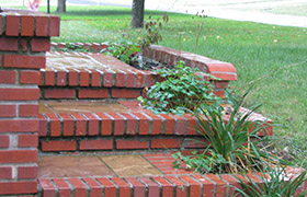 Stone and brick stairs with tiered-planter
